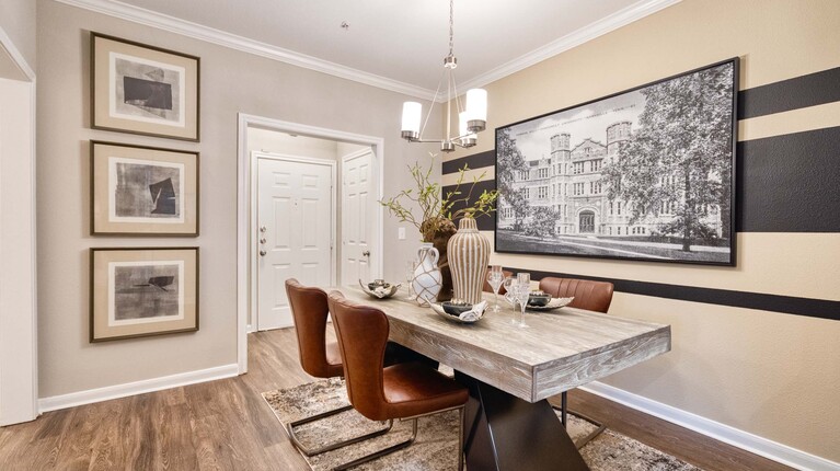 Dining area with dodern finishes and crown molding