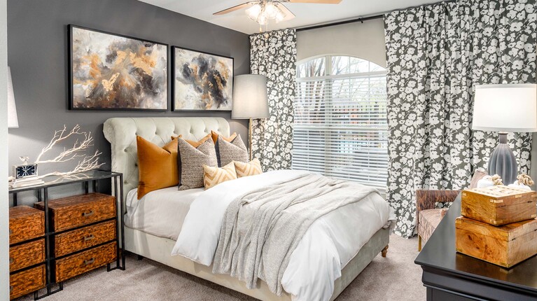 Spacious bedroom with ceiling fan 