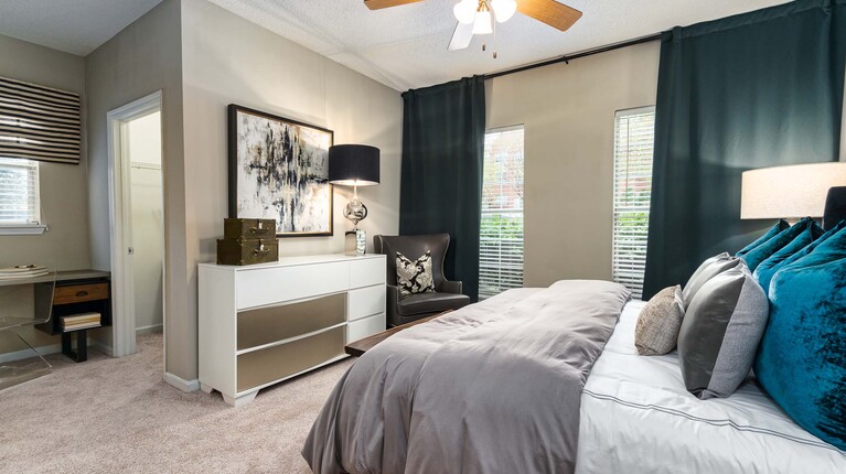 Spacious bedroom with ceiling fan