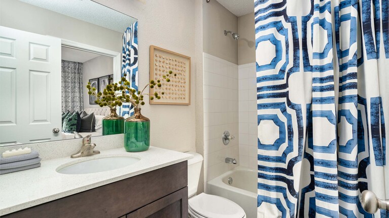 Bathroom with tub shower and large vanity