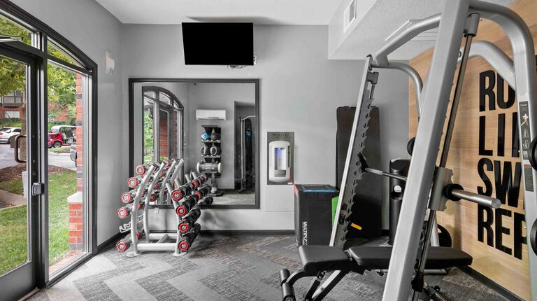 Fitness center with weights and cardio equipment